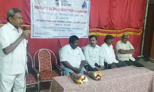 Dharmavaram Arts College principal Dr Prabhakar Reddy speaking at a seminar on road safety in Anantapur on Sunday.