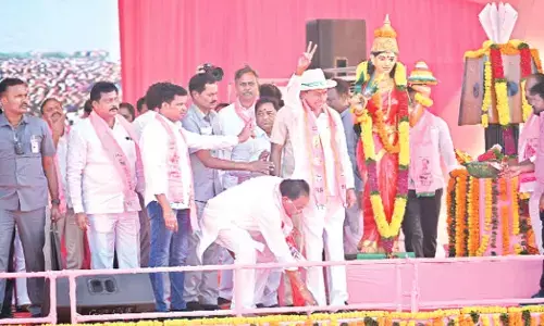 TRS candidate K Prabhakar Reddy seeking blessings of Chief Minister K Chandrashekhar Rao during  a public meeting in Chandur on Sunday
