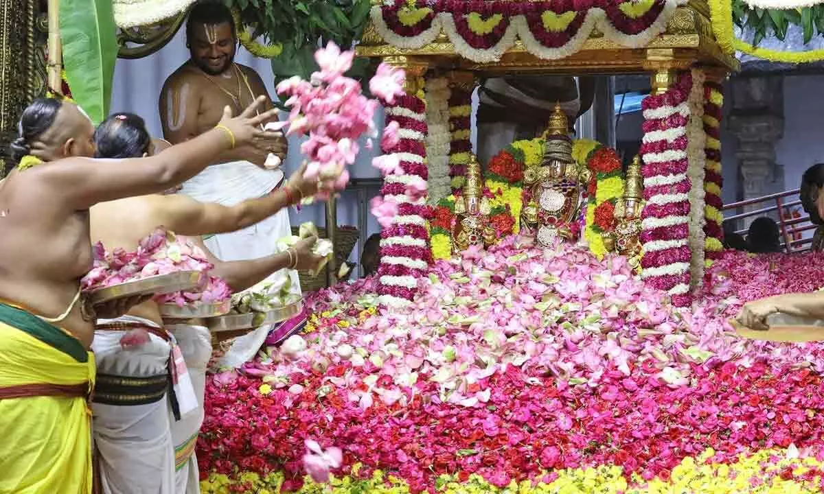 Priests making floral offerings at Pushpayagam in Tirumala on Tuesday
