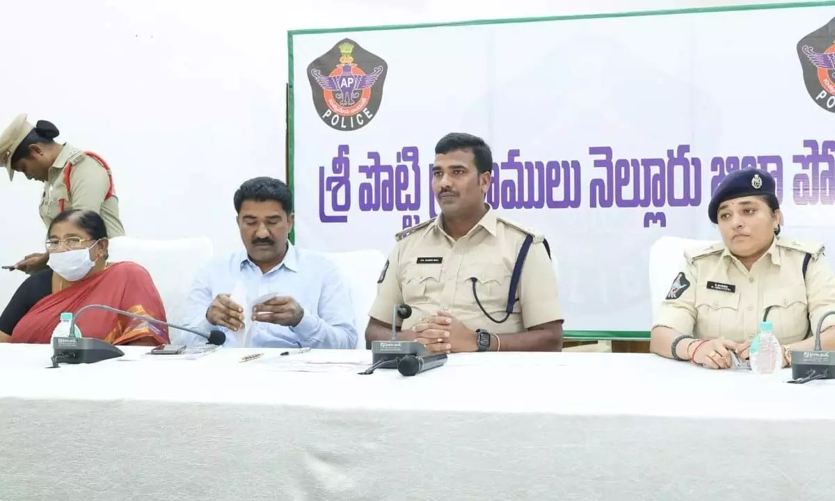 Nellore SP Ch Vijaya Rao addressing the media in Nellore on Tuesday. Surrendered Maoist Devakka is also seen.