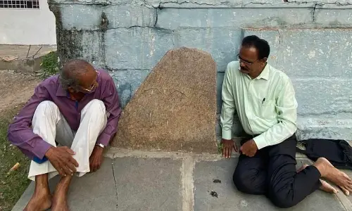 Pleach India Foundation CEO and archaeologist E Sivanagireddy with the sculptures at Kolakaluru of Tenali mandal on Tuesday