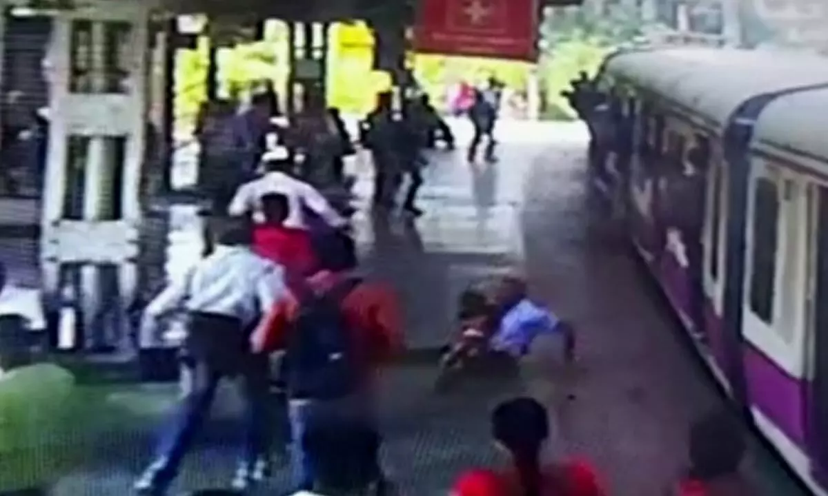 Mumbai RPF jawan saves toddler, woman, from falling under local train
