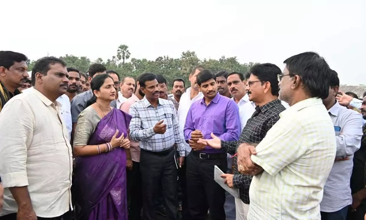 District Collector K Madhavi Latha, in-charge SP Sudhir Kumar Reddy, Jaggampet MLA Jyotula Chanti Babu and others inspecting the arrangements for the CMs visit, at Gummalladoddi village on Wednesday