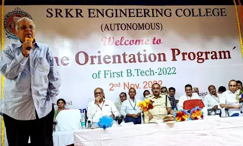 Retired IAS officer D Chakrapani addressing first year students of SRKR Engineering College at a programme in Bhimavaram on Wednesday