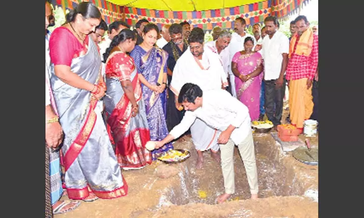 Minister Jogi Ramesh laying foundation stone for development works at Kruthivennu village  on Thursday