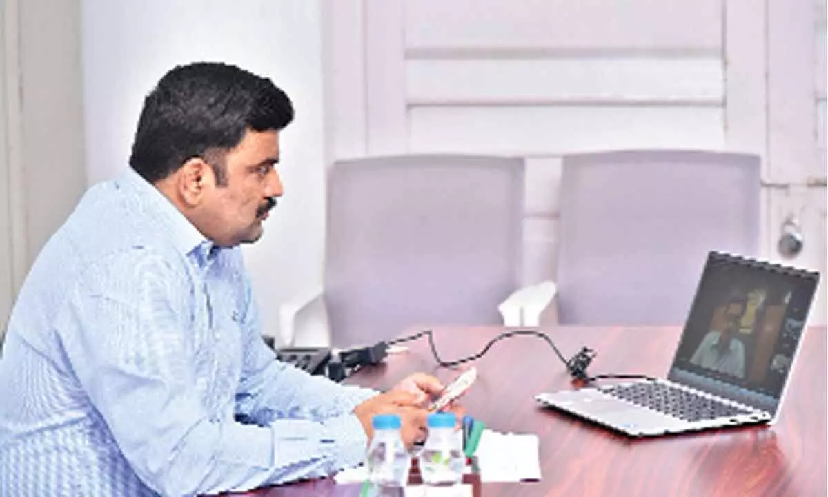 Krishna District Collector P Ranjith Basha participating in a videoconference from Machilipatnam Collectorate on Thursday