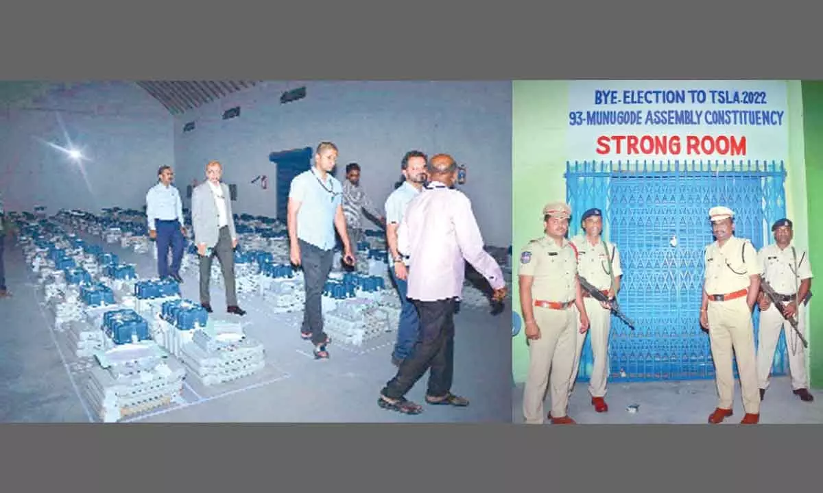 Officials inspecting the strong room where EVM are stored in Munugodu constituency on Friday; Police personnel keeping guard of strong room
