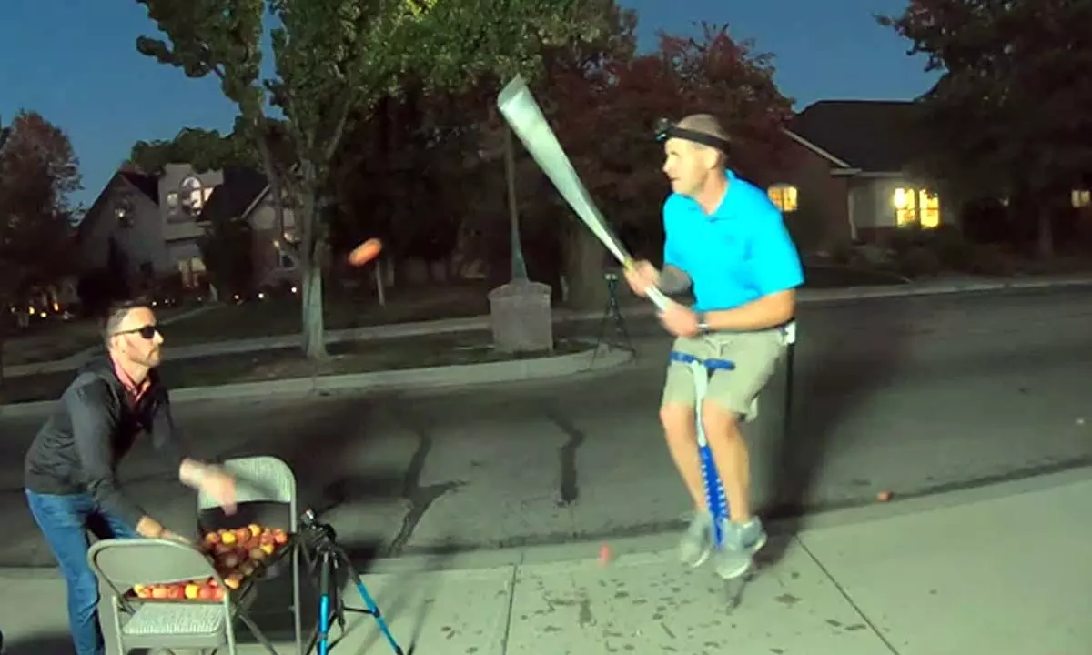 Man Establishes A Guinness World Record Using A Pogo Stick To Bounce While Chopping Apples