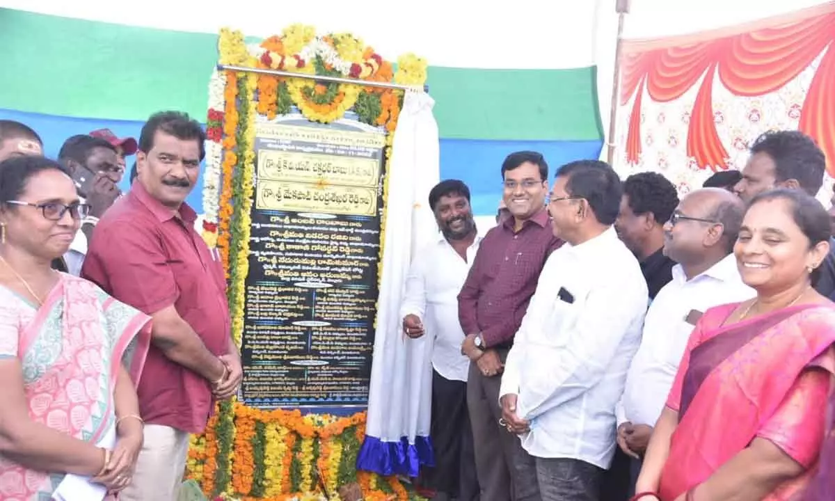 Nellore District Collector KVN Chakradhar Babu after laying foundation stone for a road in Vinjamuru along with MLA M Chandrasekhar Reddy on Tuesday