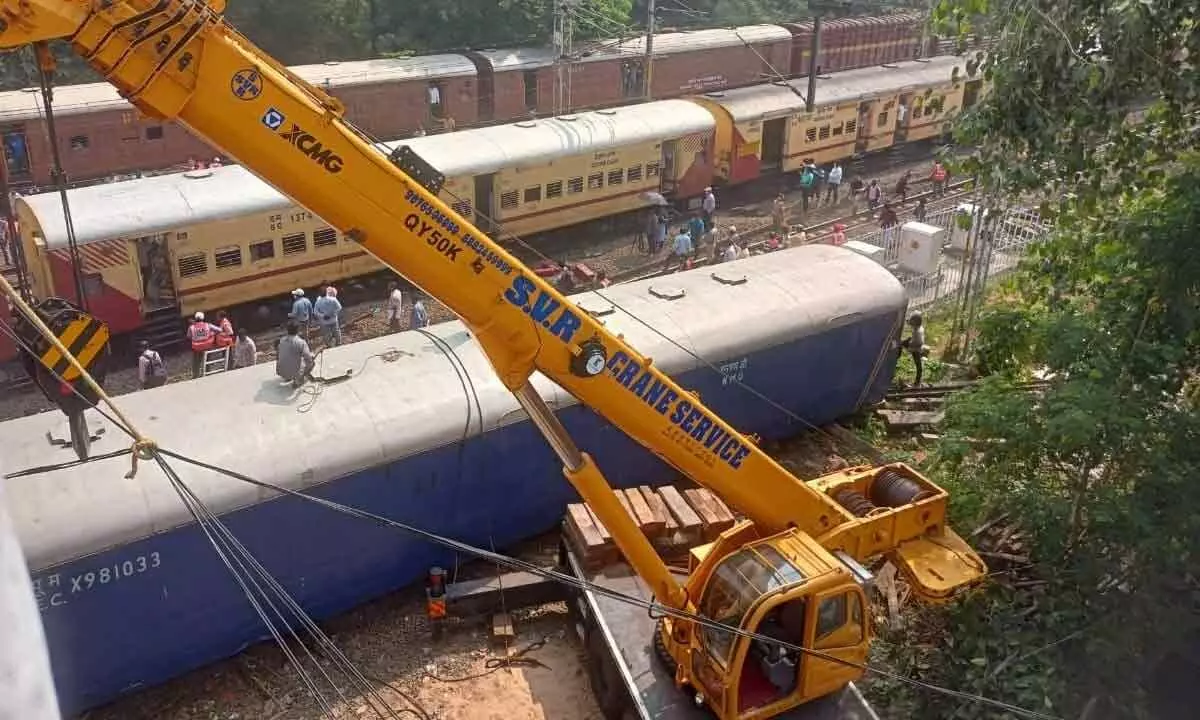 Railway staff carrying out restoration works after the derailment of goods train wagons at Rajamahendravaram railway station on Wednesday