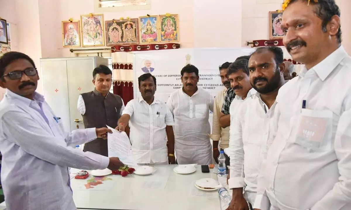 Union minister of state for social justice and empowerment A Narayana Swamy distributing cheques to physically-challenged persons in Railway Kodur on Wednesday