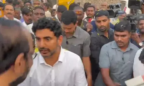 TDP national general secretary Nara Lokesh interacting with people, whose houses and compound walls are demolished for road-widening, at Ippatam village on Wednesday