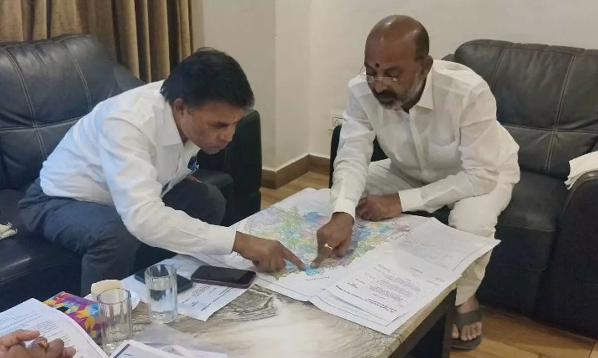 BJP State president B Sanjay Kumar meeting with Regional Officer of Central Roads and Transport Department in Karimnagar on Thursday