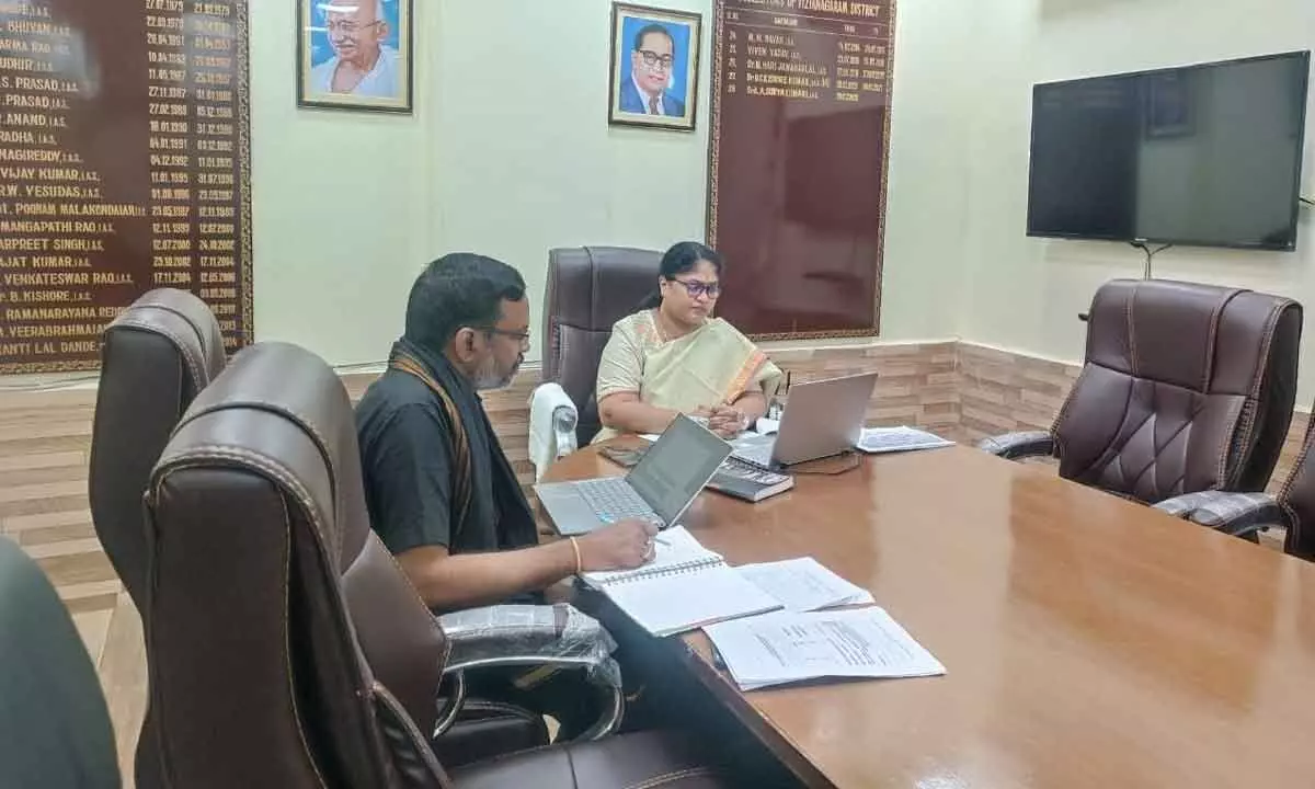 Vizianagaram Collector A Suryakumari interacting with ICRISAT scientists in a virtual mode on Friday. Agriculture Joint Director V T Rama Rao is also seen.