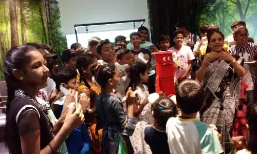 Children listening to a storytelling session of storyteller Sita Srinivas at Visakhapatnam Public Library in Visakhapatnam on Sunday