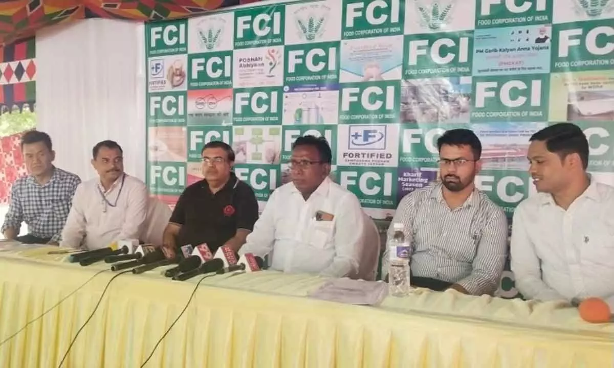 Deputy General Manager of the Food Corporation of India (FCI) Ashish Tak along with other officials addresses the media at Tadepalli on Monday