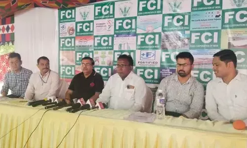 Deputy General Manager of the Food Corporation of India (FCI) Ashish Tak along with other officials addresses the media at Tadepalli on Monday