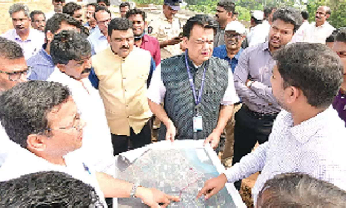 Principal Secretary Praveen Prakash, Krishna District Collector P Ranjith Basha, MLA Perni Nani and the officials of National Highways Authority inspect the land for acquisition at Machilipatnam on Tuesday