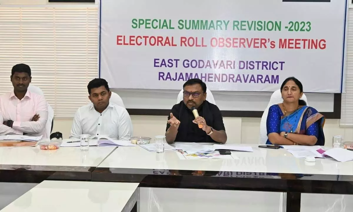 East Godavari District Electoral Roll Observer Dr P Bhaskara speaking at a review meeting in Rajamahendravaram on Wednesday. District Collector K Madhavi Latha, Joint Collector Ch Sridhar and Municipal Commissioner K Dinesh Kumar are also seen.