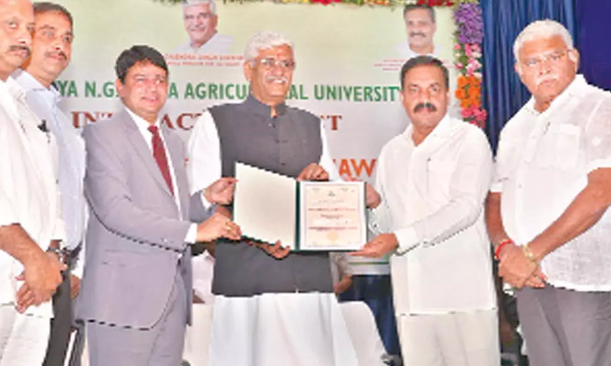 Vice-chancellor of Acharya NG Ranga Agricultural University Prof Vishnuvardhan Reddy presenting the honorary doctorate to Union Jal Shakti minister Gajendra Singh Shekhawat in Tirupati on Wednesday. State agriculture ministers Kakani Govardhan Reddy, water resources minister Ambati Rambabu and others are also seen