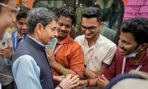Governor R N Ravi interacts with delegates before flagging off a train carrying them to the Kashi Tamil Sangamam, at the Egmore railway station in Chennai on Thursday. The Kashi Tamil Sangamam is being held in Varanasi
