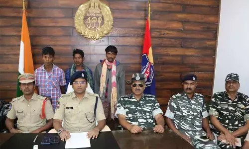 SP G Vineeth showing arrested Maoist militia members before the media in Kothagudem  on Friday