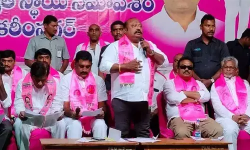 Minister G Kamalakar addressing a TRS party meeting in Karimnagar on Friday