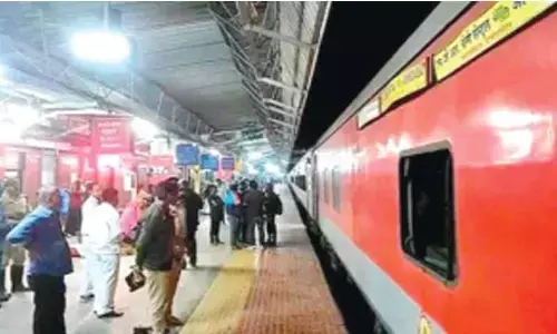 Passengers before the pantry car of Navjeevan express at Gudur station