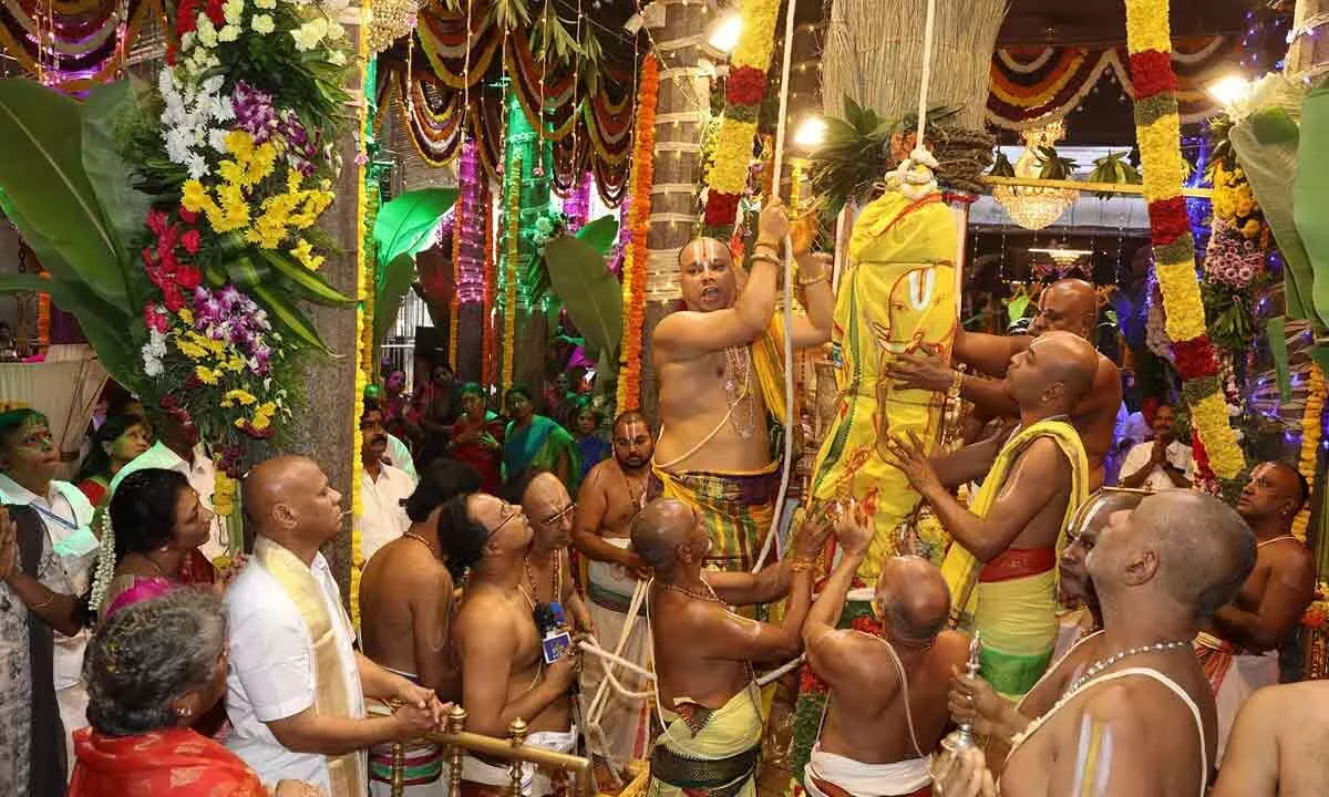 Priests conducting Dhwajarohanam to mark the beginning of nine-day Karthika Brahmotsavams of Sri Padmavathi Ammavaru at Tiruchanur temple on Sunday