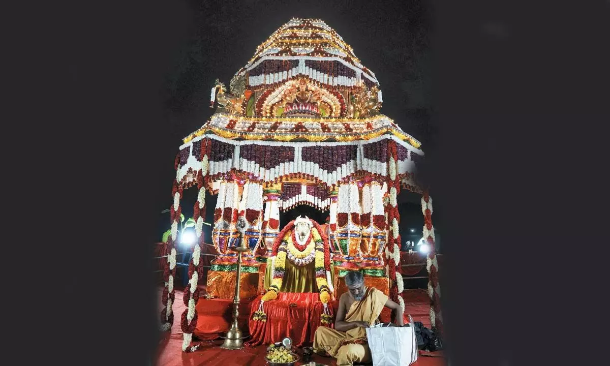 A decorated boat (Teppotsava) with the idol of Dodda Basavanna (Bull) float on the historic Kempabudhi Lake as part of Kadalekai Parishe (Groundnut Festival) in Bengaluru on Monday