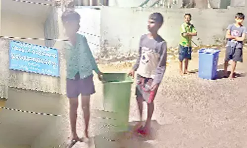 SC Hostel at Mallayya Agraharam, Kakinada; Students carrying garbage bins in the hostel during nights