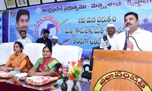 Krishna District Collector P Ranjith Basha addressing the fishermen at a programme in Machilipatnam on Monday