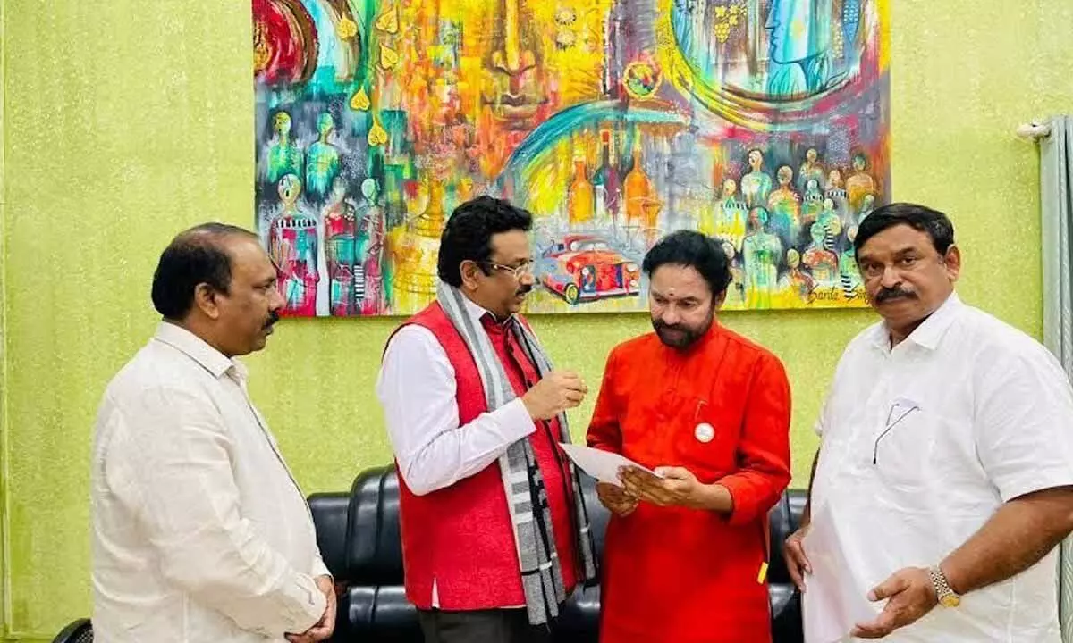 Chairman of TTAA O Naresh Kumar and its president K Vijay Mohan submitting a representation to Union Minister for Tourism G Kishan Reddy in Visakhapatnam  on Tuesday