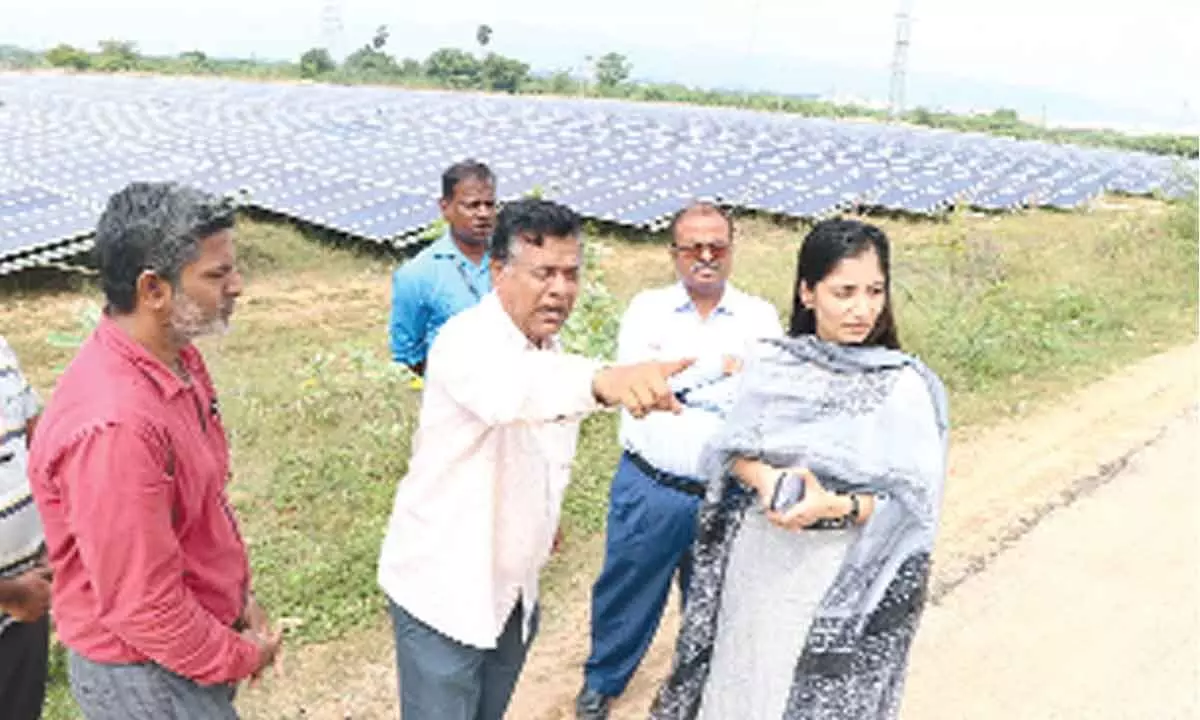 Municipal Commissioner Anupama Anjali inspecting the works of solar power plant at Thukivakam of Renigunta mandal on Thursday. ME Chandrasekhar and others are seen.
