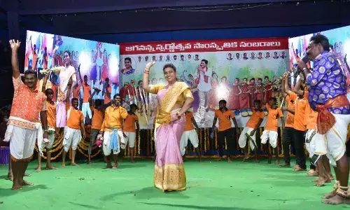Tourism Minister RK Roja dancing on the dais at a programme at Sri Venkateswara Vignana Mandiram in Guntur on Thursday