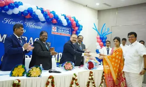 Central Bank of India Managing Director and Chief Executive Officer MV Rao giving away a cheque to a beneficiary at Credit Camp organised in Vijayawada on Thursday