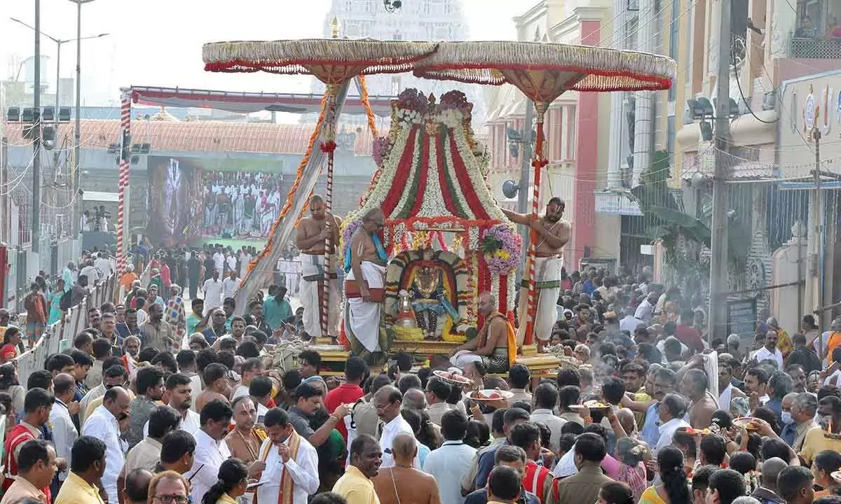 Goddess Padmavathi in the attire of Venna Krishna taking a ride on Sarvabhoopala Vahanam at Tiruchanur on Friday