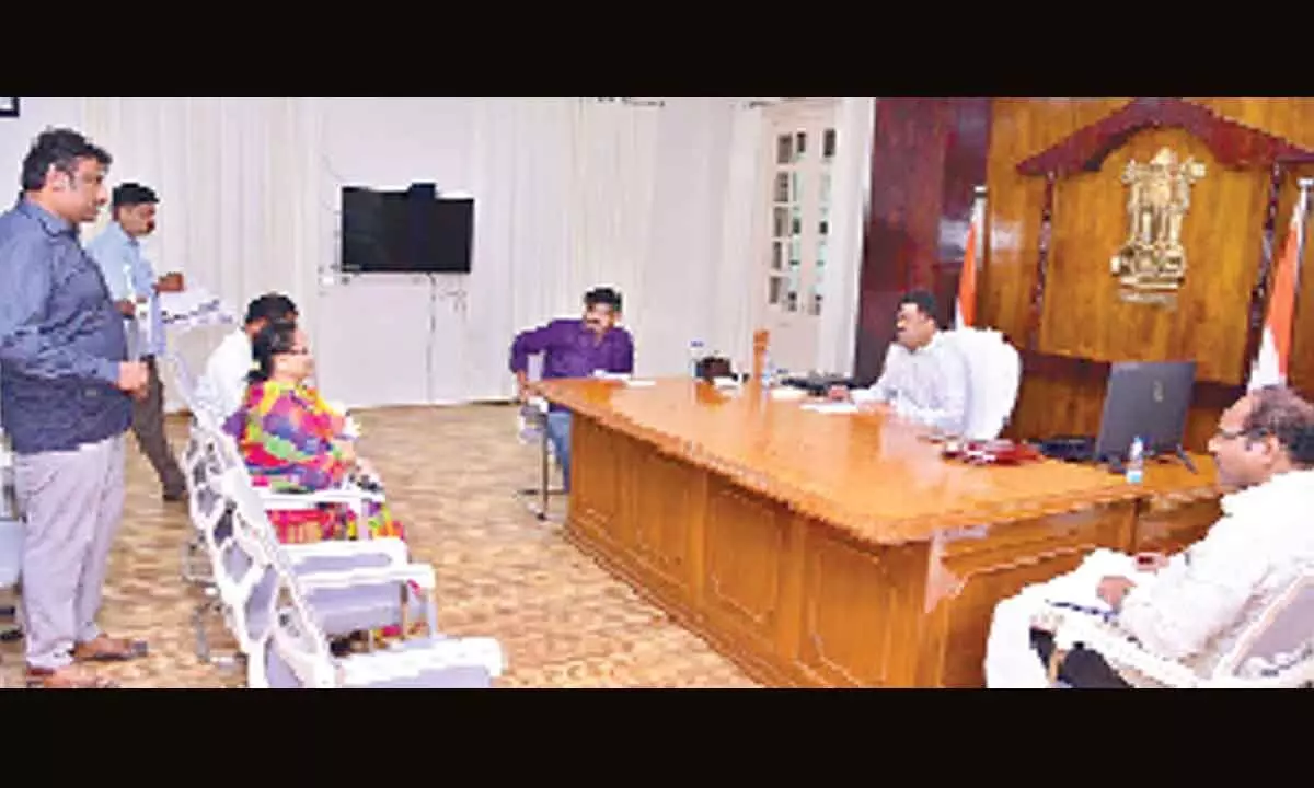 Krishna District Collector P Ranjith Basha and MLA Perni Nani discussing Machilipatnam constituency development works  at the Collectorate on Friday