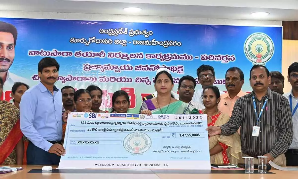 District Collector K Madhavi Latha, SP Ch Sudhir Kumar Reddy and others presenting loan assistance for alternative livelihood programmes to the beneficiaries at the Collectorate in Rajamahendravaram on Friday