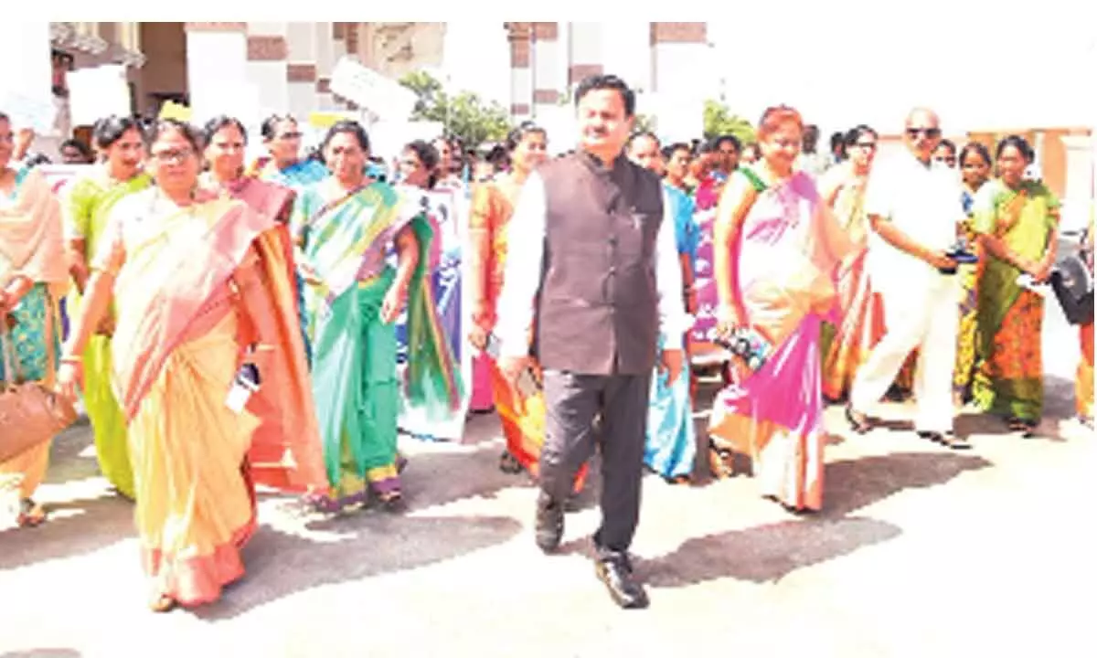 District Collector K Venkataramana Reddy leading the awareness rally from Collectorate in Tirupati on Friday.