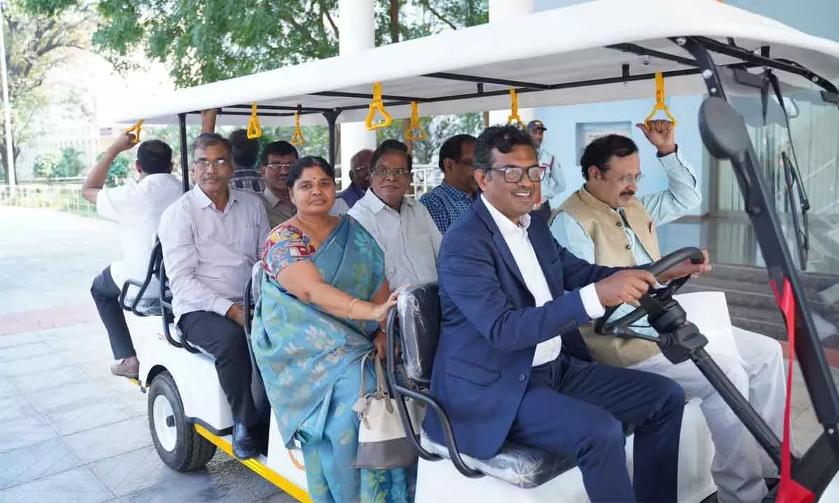 NITW Director and Chairman In-Charge  Prof. N V Ramana Rao, Hitachi Energy India and South Asia MD and CEO N Venu  and others go for a ride on electric vehicle on  NITW campus on Friday