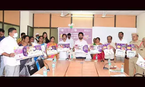 Joint Collector CM Saikanth Varma releasing a poster on eradication of gender bias in Kadapa on Friday
