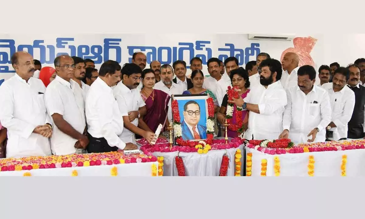 YSRCP leaders and ministers pay tributes to Dr B R Ambedkar on the occasion of Constitutional Day at YSRCP central office in Tadepalli on Saturday