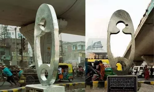 A giant safety pin highlighting dignified healthcare for women