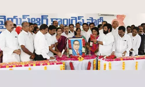 YSRCP leaders and ministers pay tributes to Dr B R Ambedkar on the occasion of Constitutional Day at YSRCP central office in Tadepalli on Saturday