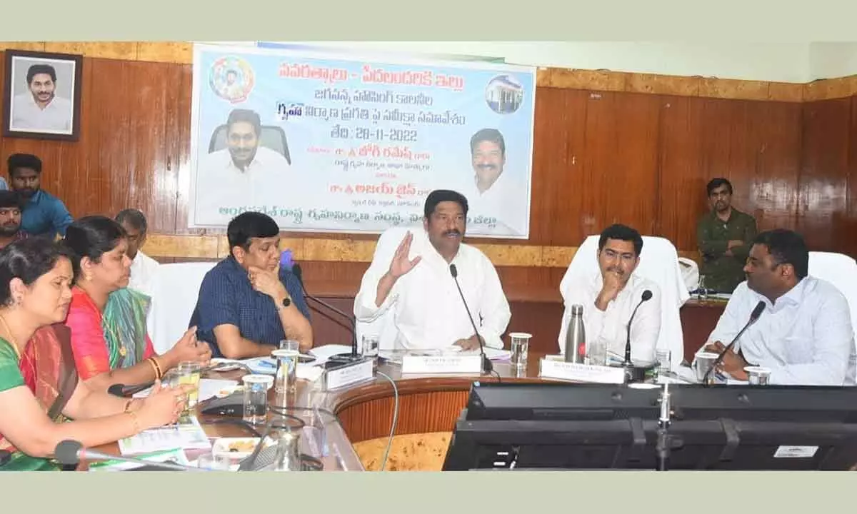 Minister for Housing Jogi Ramesh speaking at a meeting in Visakhapatnam on Monday. Special Chief Secretary Ajay Jain and others are seen.