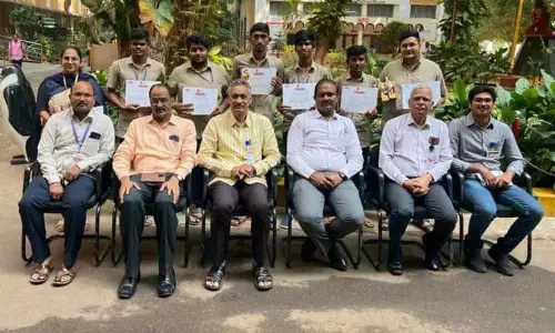 Students of PB Siddhartha College, who won competitions, with the College management in Vijayawada on Monday