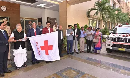 Governor Biswabhusan Harichandan flagging off two vehicles of State Disaster Response Force of Indian Red Cross Society at Raj Bhavan in Vijayawada on Monday