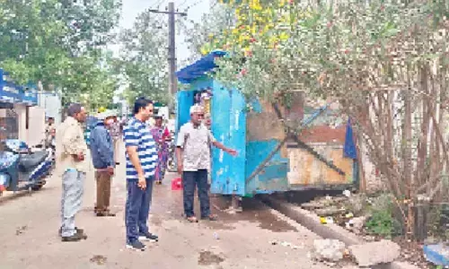 KMC Additional Commissioner Ch Naga Narasimha Rao inspecting a locality in 25th division in Kakinada on Friday
