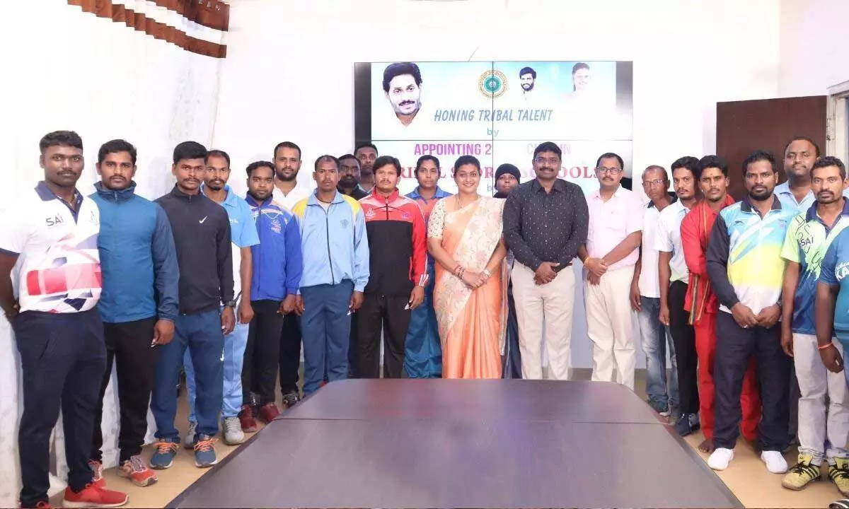 Minister RK Roja with the newly appointed coaches in Vijayawada on Sunday
